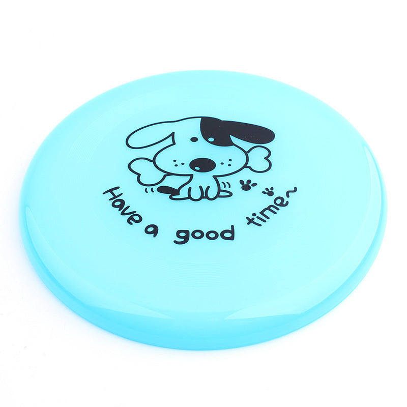 Blue frisbee with a dog illustration and text on a white background